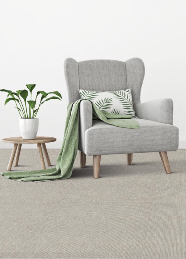 grey chair on grey carpet with wood side table and Lime Cream decor.